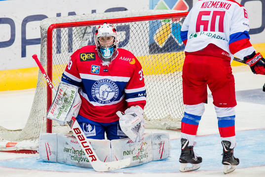 Goaltender Henrik Haukeland of Norway looks dejected