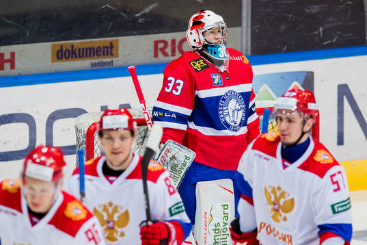 Goaltender Henrik Haukeland of Norway looks dejected