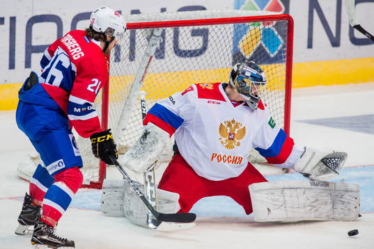 Kristian Forsberg of Norway and goaltender Aleksandr