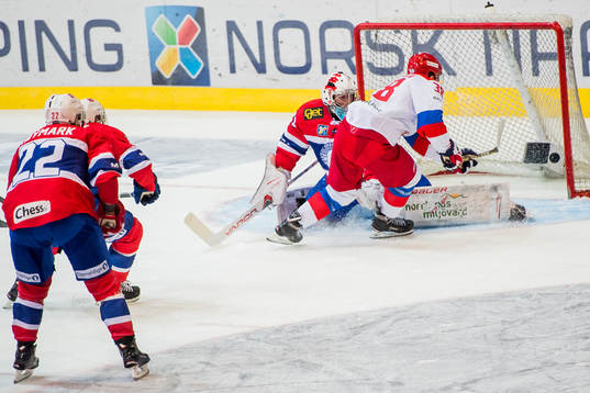 Mikhail Naumenkov of Russia scores 1-1 behind goaltender