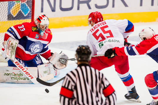 Goaltender Henrik Haukeland of Norway and Vladimir Tkachyov