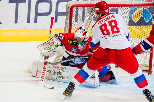 Goaltender Henrik Haukeland of Norway and Nikitia Tryamkin