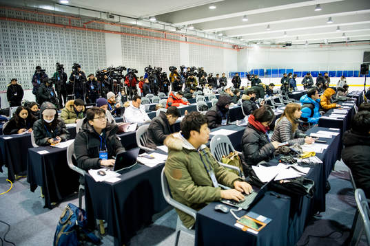 Journalists attend a press conference