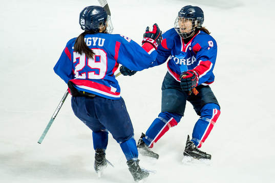 Lee Jingyu and Park Jongah of Korea celebrate the 2-1 goal