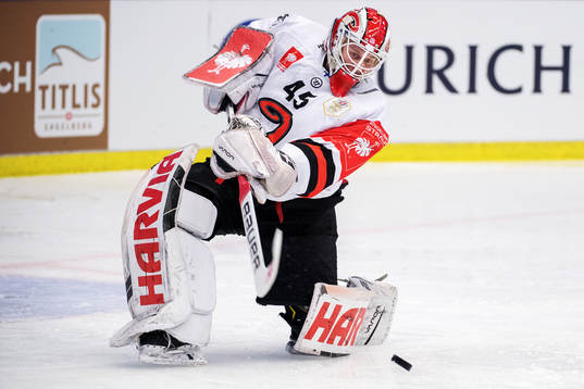 Jyväskyläs goalkeeper Juho Olkinuora clears the puck