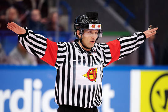 A referee shows the decision
