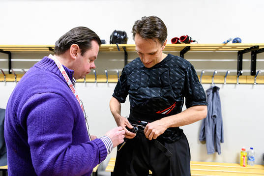 The referee team gets mics prior to the CHL final game