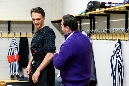 The referee team gets mics prior to the CHL final game