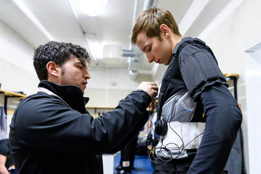 The referee team gets mics prior to the CHL final game
