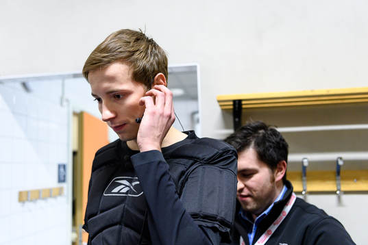 The referee team gets mics prior to the CHL final game