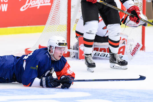 Elias Pettersson of Växjö takes a fall to the ice