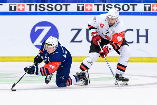 Tuomas Kiiskinen of Växjö takes a fall in a fight for the