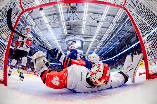 Martin Lundberg of Växjö falls into goals Juho Olkinuora