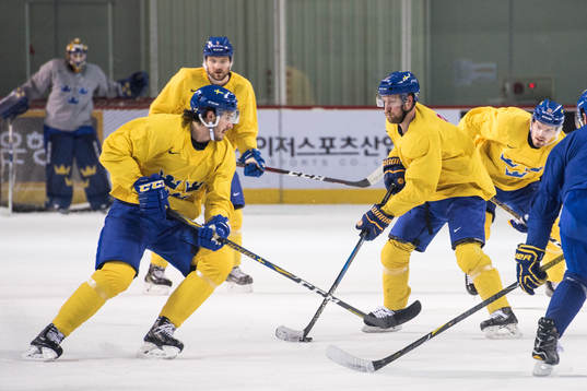 Linus Omark of Sweden controls the puck