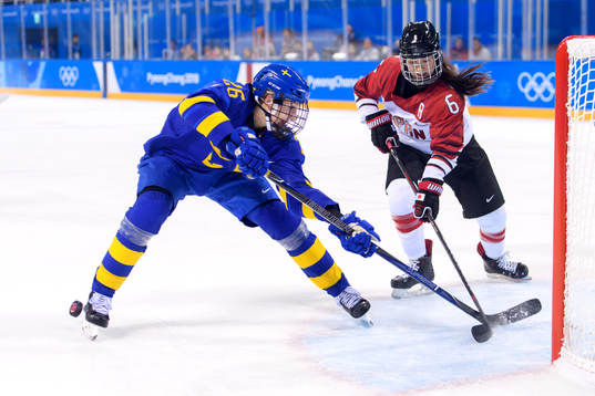 A shot from Hanna Olsson of Sweden is blocked by Sena