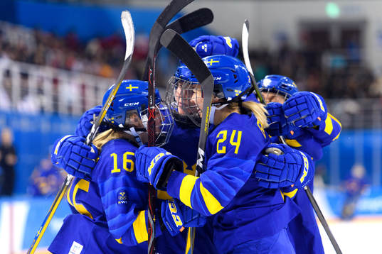 Sara Hjalmarsson of Sweden celebrates with her teammates