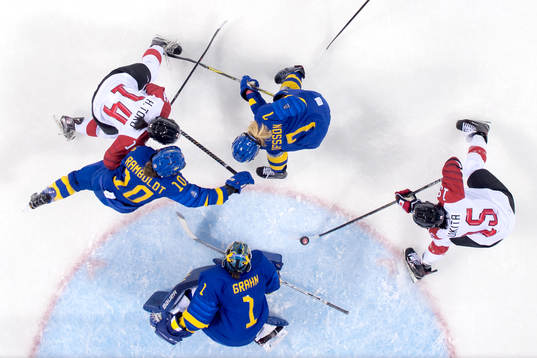Rui Ukita of Japan scores 1-1 behind goaltender Sara Grahn