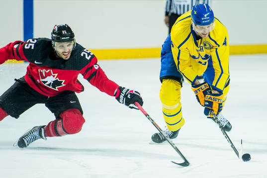 Maxim Lapierre of Canada and Staffan Kronwall of Sweden