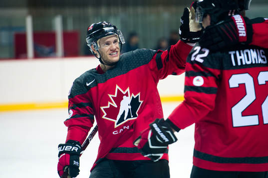 Christian Thomas of Canada celebrates with Mat Robinson