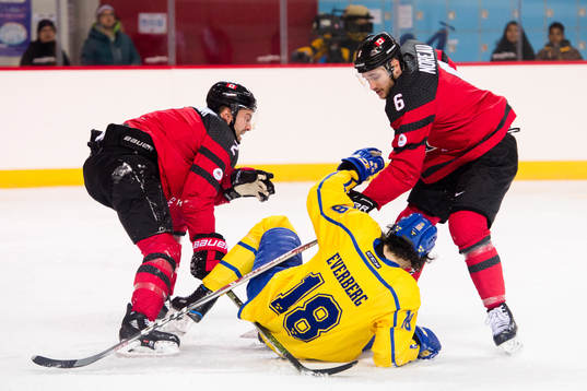 Marc-Andre Gragnani and Maxim Noreau of Canada against
