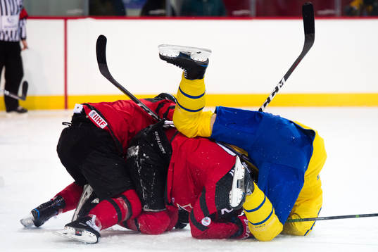 Marc-Andre Gragnani and Maxim Noreau of Canada against