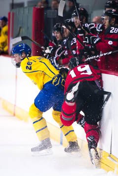Rasmus Dahlin of Sweden and Gilbert Brule of Canada