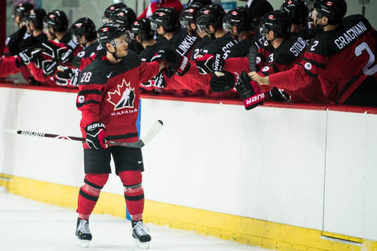 Mat Robinson of Canada celebrates with teammates