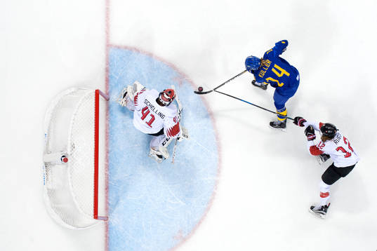 Sabina Küller of Sweden with puck in front of Goaltender