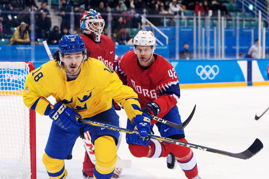 Dennis Everberg of Sweden and Goaltender Lars Haugen as