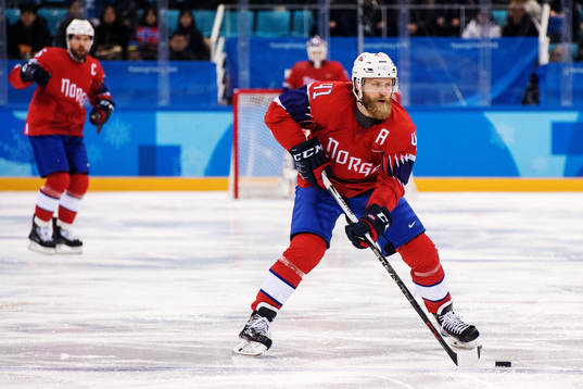 Patrick Thoresen of Norway with the puck in the Men's Ice