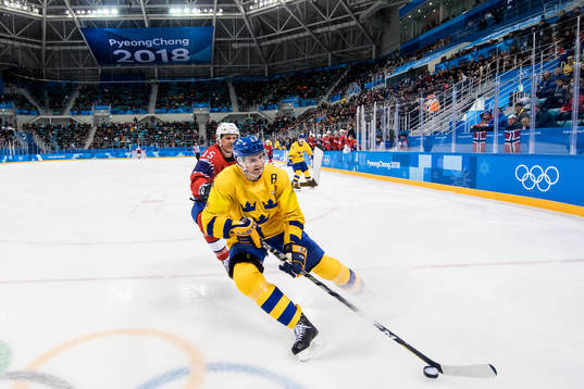 Staffan Kronwall of Sweden and Tommy Kristiansen of Norway