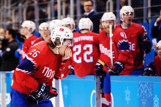 Kristian Forsberg of Norway bleeds in the Men's Ice Hockey