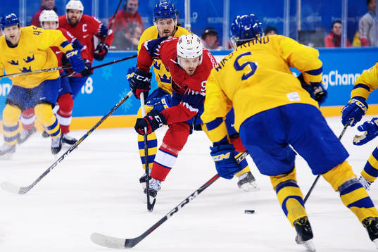 Mats Rosseli Olsen of Norway with the puck in the Men's Ice