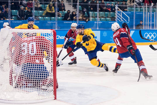 Fredrik Pettersson of Sweden shoots against Goaltender Lars