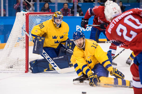 Anders Bastiansen of Norway shoots at Goaltender Viktor