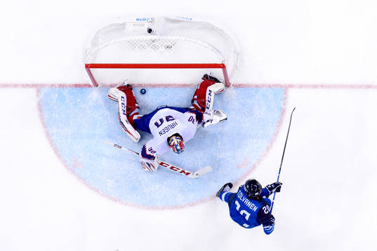 Eeli Tolvanen of Finland scores 2-1 behind goaltender Lars