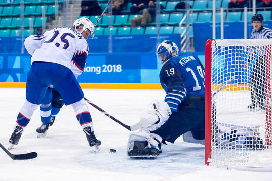 Tommy Kristiansen of Norway and Goaltender Mikko Koskinen
