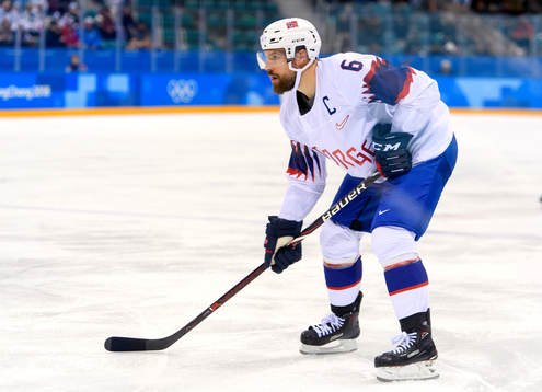 Jonas Holøs of Norway in the ice hockey game between