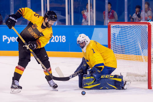 Felix Schutz of Germany and Goaltender Jhonas Enroth of