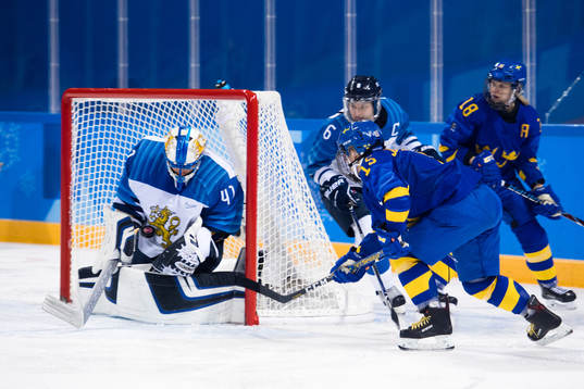 Lisa Johansson of Sweden against Goaltender Noora Raty of