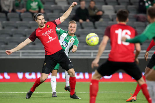 Hammarbys Sander Svendsen shots past Vasalunds Linus