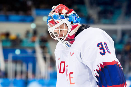 Goaltender Lars Haugen of Norway looks dejected in the