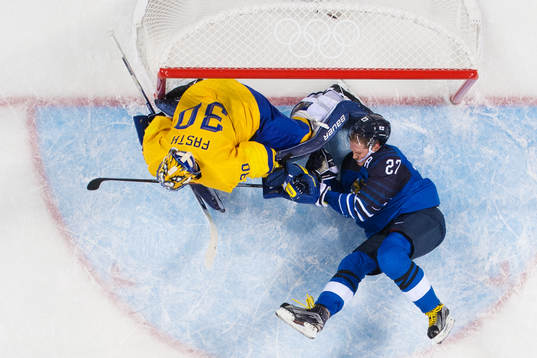 Goaltender Viktor Fasth of Sweden and Petri Kontiola of