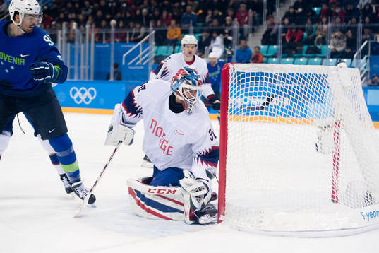 Goaltender Lars Haugen of Norway looks dejected