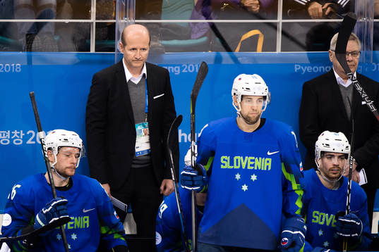 Team Slovenia  looks dejected in the Men's Ice Hockey