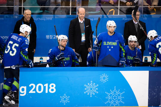 Team Slovenia  looks dejected in the Men's Ice Hockey