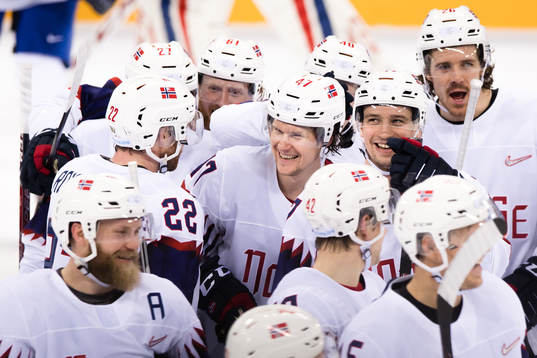 Team Norway celebrates with the game winning goal scorer
