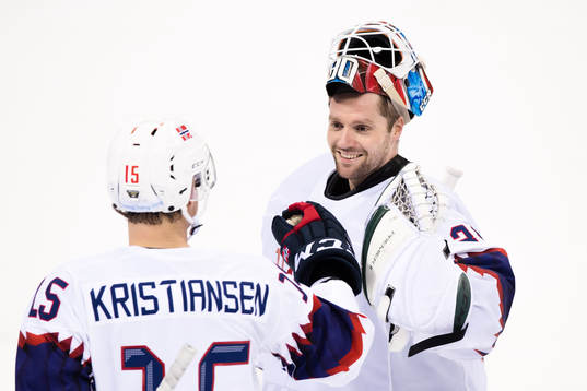 Goaltender Lars Haugen andTommy Kristiansen of Norway