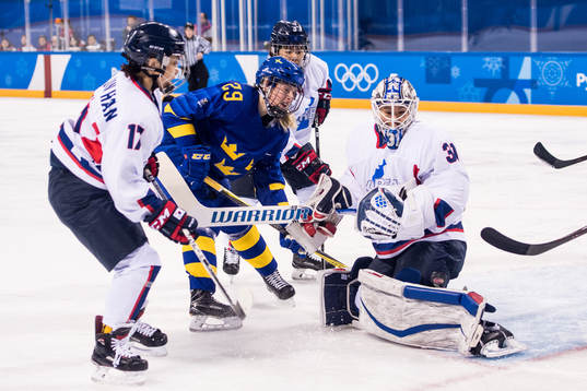 Olivia Carlsson of Sweden in action with Han Soojin of