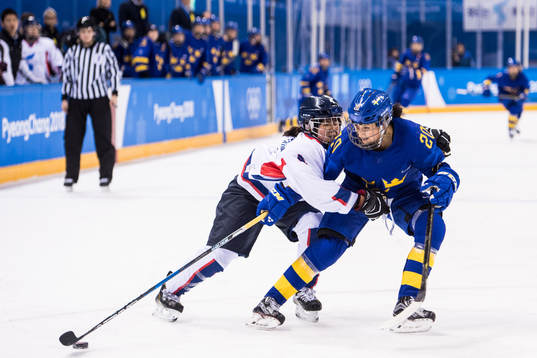 Fanny Rask of Sweden in action with Kim Un Hyang of Korea